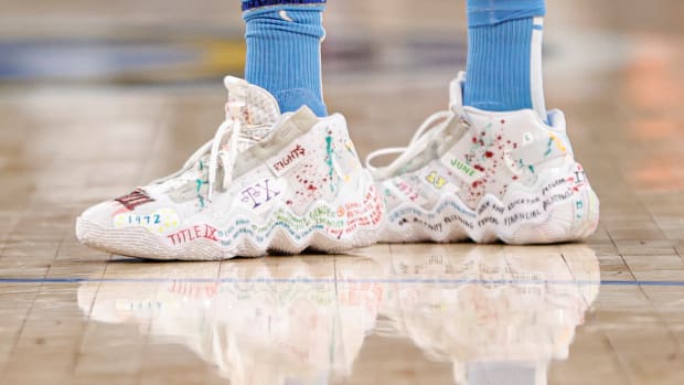 Candace Parker's white Adidas shoes.
